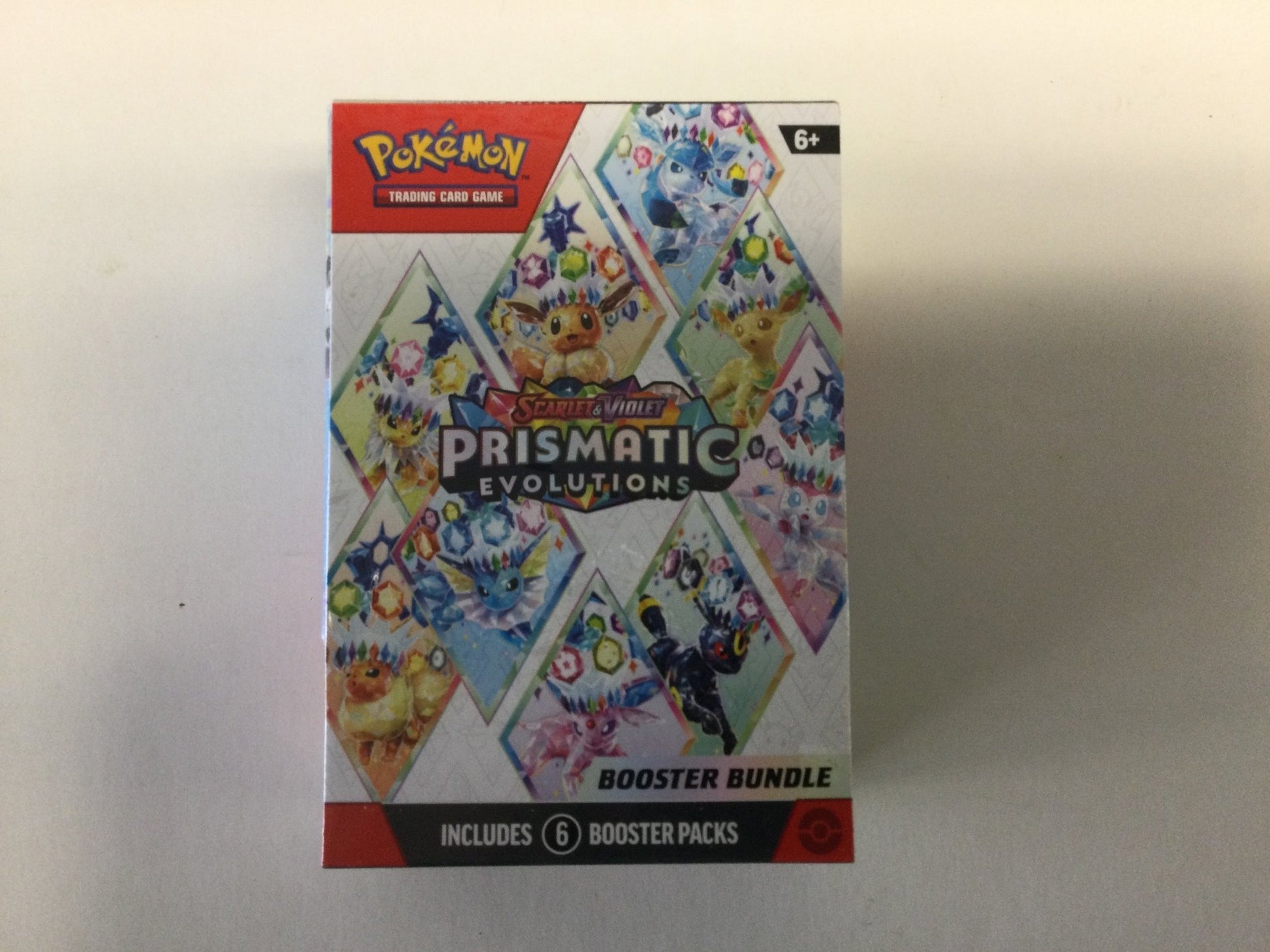 Pokémon Prismatic Evolutions Booster Bundle - WiredVillage Games - The Pokémon Company